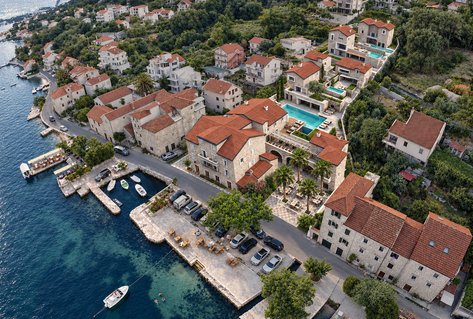 Hotelski kompleks u Prčnju – ptičja perspektiva konkursnog rešenja sa kamenim objektima, bazenima i terasama na padini uz more